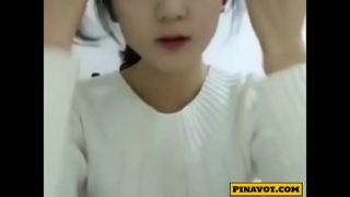 Sexy Asian teen enjoys stripping on a webcam